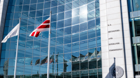 United States Securities and Exchange Commission SEC architecture closeup with modern building sign and logo with red flags by glass windows