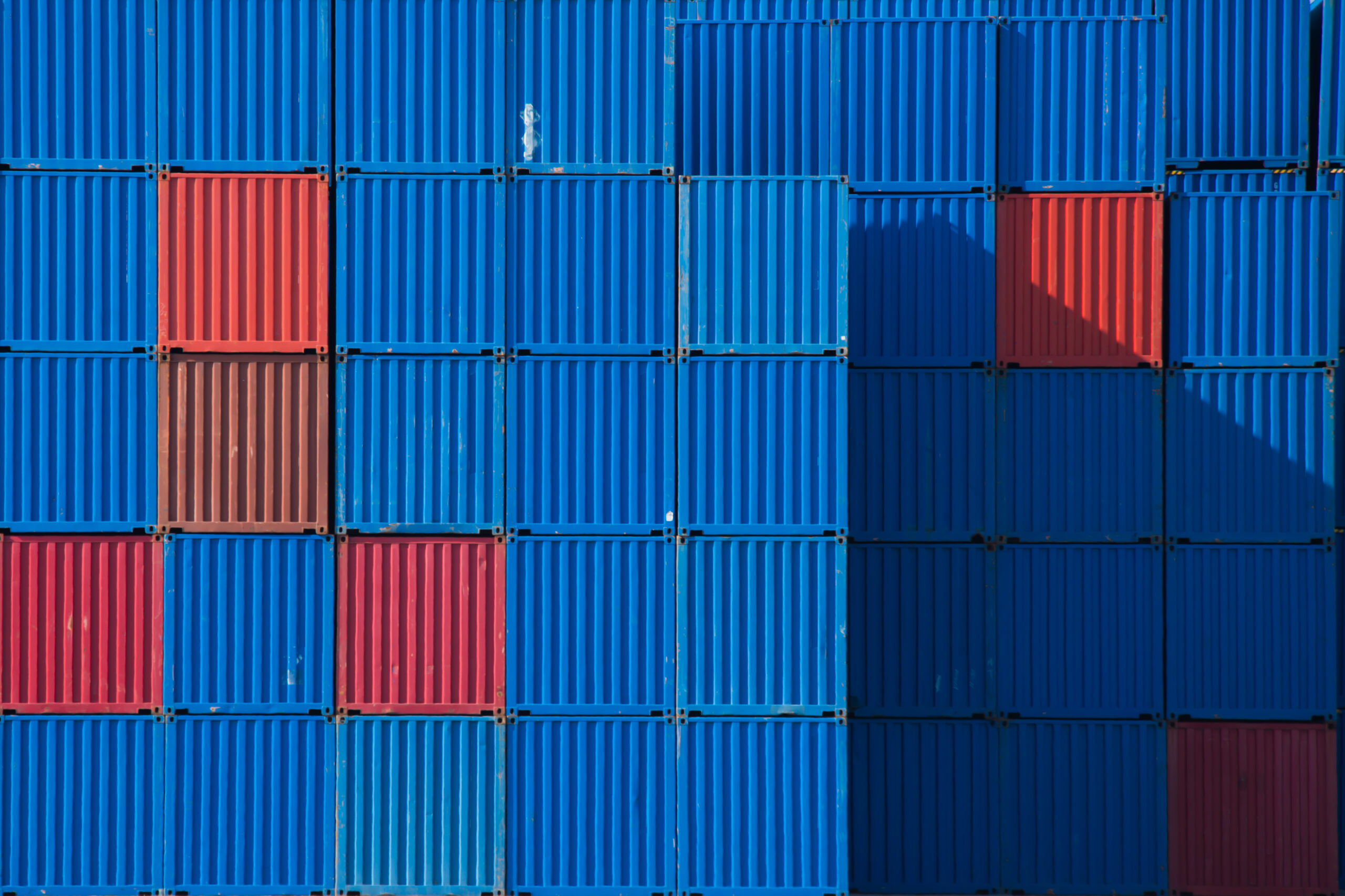 Stacks of shipping containers in a row